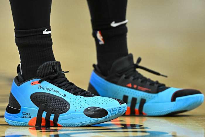 Cleveland Cavaliers guard Donovan Mitchell's blue and black adidas sneakers.